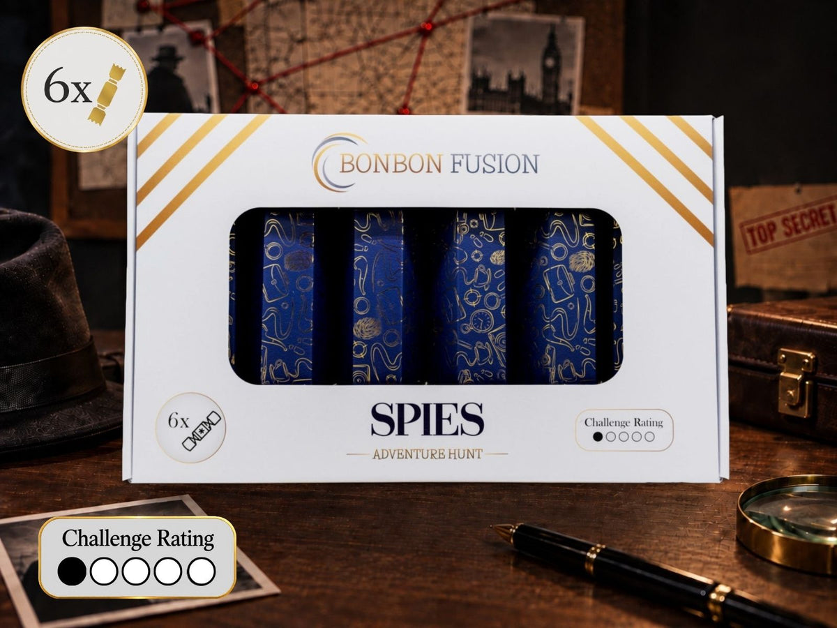 Bonbon Fusion Spies Adventure Hunt pack of six navy and gold Christmas bonbons on a detective's desk with a fedora, magnifying glass, pen and "Top Secret" files, with a challenge rating of 1 out of 5