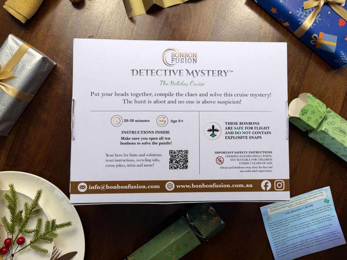 Back of Bonbon Fusion’s Holiday Cruise Detective Mystery box, showing ages 8+, 20–30 minutes playtime, instructions, safety information and a QR code, on a festive wooden table.